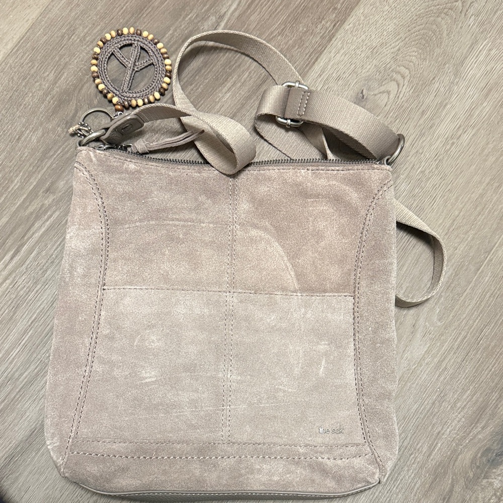 The Sak Taupe Suede Crossbody Bag with Beaded Charm